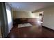 Cozy living room with hardwood floors, wainscoting, and a piano at 589 S 100 W, Franklin, IN 46131