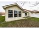Back exterior featuring a patio, lawn and view of a neighboring house at 6145 Crystal View Dr, Indianapolis, IN 46237