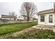Backyard featuring lawn, a leafless tree and a view of neighboring houses beyond the wooden fence at 6145 Crystal View Dr, Indianapolis, IN 46237