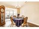 Elegant dining room with a chandelier and seating for four at 6145 Crystal View Dr, Indianapolis, IN 46237