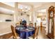 A dining room features a chandelier over a table set for four with an antique grandfather clock nearby at 6145 Crystal View Dr, Indianapolis, IN 46237