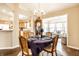 Elegant dining room with a chandelier and seating for four with an open design at 6145 Crystal View Dr, Indianapolis, IN 46237