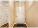 Inviting entryway with wood floors, neutral walls, and a bright white front door at 6145 Crystal View Dr, Indianapolis, IN 46237