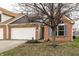 Charming single-Gathering home featuring a brick facade, attached garage and well-maintained landscaping at 6145 Crystal View Dr, Indianapolis, IN 46237