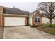 Charming single-Gathering home featuring a brick facade, attached garage and well-maintained landscaping at 6145 Crystal View Dr, Indianapolis, IN 46237