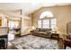 Bright and spacious living room with vaulted ceilings, large windows, and a comfortable seating area at 6145 Crystal View Dr, Indianapolis, IN 46237