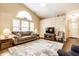 Bright and spacious living room with vaulted ceilings, large windows, and comfortable seating area at 6145 Crystal View Dr, Indianapolis, IN 46237
