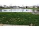 Expansive backyard view overlooking a tranquil pond, offering a serene outdoor space with neighborhood views at 6418 W Oxford Ln, McCordsville, IN 46055