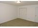 A carpeted bedroom features neutral walls, white trim, and closet with a door at 6418 W Oxford Ln, McCordsville, IN 46055