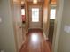 Inviting hallway with wood floors and arched doorways leading to other rooms at 6418 W Oxford Ln, McCordsville, IN 46055