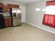 Eat-in kitchen featuring stainless steel refrigerator and chandelier lighting at 6418 W Oxford Ln, McCordsville, IN 46055