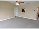 Open living area featuring a ceiling fan and a view to the kitchen at 6418 W Oxford Ln, McCordsville, IN 46055