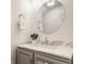 Bathroom vanity features gray cabinets, a marble countertop, chrome fixtures, and modern lighting at 6733 Dorchester Dr, Zionsville, IN 46077
