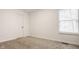 Cozy carpeted bedroom with ample natural light from the window at 6733 Dorchester Dr, Zionsville, IN 46077