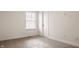 Bright bedroom with neutral carpet, a window, and white trim at 6733 Dorchester Dr, Zionsville, IN 46077