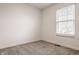 Neutral carpeted bedroom with natural light streaming through the window at 6733 Dorchester Dr, Zionsville, IN 46077