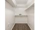 Walk-in closet with wood floor and built-in shelving for optimal storage at 6733 Dorchester Dr, Zionsville, IN 46077
