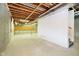 Unfinished basement ready for customization, featuring exposed beams and concrete floor at 7271 Catboat Ct, Fishers, IN 46038