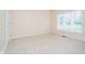 Empty bedroom features neutral paint, natural light, and carpet flooring at 7271 Catboat Ct, Fishers, IN 46038