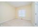 Empty bedroom features neutral paint, natural light, and carpet flooring at 7271 Catboat Ct, Fishers, IN 46038