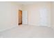 Empty bedroom featuring neutral paint, carpet flooring, and open doorway at 7271 Catboat Ct, Fishers, IN 46038