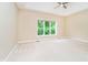 Bright and airy room with plush carpeting and a large window at 7271 Catboat Ct, Fishers, IN 46038