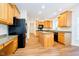 Kitchen featuring stainless steel appliances, wooden cabinets, and stone countertops at 7271 Catboat Ct, Fishers, IN 46038