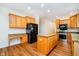 Spacious kitchen with stainless appliances, an island, and stylish granite countertops at 7271 Catboat Ct, Fishers, IN 46038