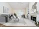 Cozy living room with fireplace, built-in shelving, and comfortable seating at 7271 Catboat Ct, Fishers, IN 46038