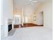 Open living area with fireplace, high ceilings, and lots of natural light at 7271 Catboat Ct, Fishers, IN 46038