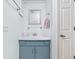 Bathroom sink with blue cabinet at 7349 Castleton Farms N Dr, Indianapolis, IN 46256