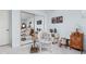 Bedroom featuring a built-in closet with mirrored doors, a wicker chair, and carpet at 7349 Castleton Farms N Dr, Indianapolis, IN 46256