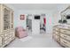 Spacious bedroom featuring a walk-in closet, an en suite bathroom, and a vanity with a mirror at 7349 Castleton Farms N Dr, Indianapolis, IN 46256