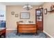 Charming dining room featuring vintage furniture, hardwood floors, and decorative wall art at 7349 Castleton Farms N Dr, Indianapolis, IN 46256
