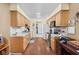 Functional kitchen with wood cabinets, white countertops, and stainless steel appliances at 7349 Castleton Farms N Dr, Indianapolis, IN 46256