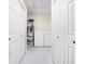 Practical laundry room with ample storage space, shelving, and washer/dryer units at 7349 Castleton Farms N Dr, Indianapolis, IN 46256