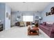 Spacious living room with ample seating and natural light at 7349 Castleton Farms N Dr, Indianapolis, IN 46256