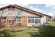 A single story home with a screened in porch, brick facade, and well manicured backyard at 7349 Castleton Farms N Dr, Indianapolis, IN 46256
