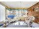 Bright, cozy sunroom with charming decor and ample natural light at 7349 Castleton Farms N Dr, Indianapolis, IN 46256