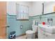 Cozy bathroom featuring green tile and classic fixtures at 791 S Us Highway 31, Whiteland, IN 46184