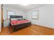 Bedroom showcasing hardwood floors and natural light from the windows at 791 S Us Highway 31, Whiteland, IN 46184