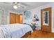 Bedroom featuring wood floors, closet space, and a sitting area at 791 S Us Highway 31, Whiteland, IN 46184