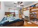 Functional bedroom with wood floors, a ceiling fan, built-in shelves, and study area at 791 S Us Highway 31, Whiteland, IN 46184