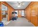 Finished bonus room featuring wood paneling, carpeted flooring, and a ceiling fan at 791 S Us Highway 31, Whiteland, IN 46184