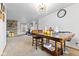 Cozy dining room boasts a wood table with views of the living room and a unique modern light fixture at 791 S Us Highway 31, Whiteland, IN 46184