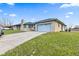 Charming single-story home features a stone exterior, covered front porch and attached garage on a sunny lot at 791 S Us Highway 31, Whiteland, IN 46184