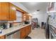 Functional kitchen features wooden cabinets, laminate countertops, stainless steel dishwasher and a double-basin sink at 791 S Us Highway 31, Whiteland, IN 46184