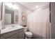 Modern bathroom with a vanity, framed pictures and modern shower curtain at 8194 Bostic Ct, Fishers, IN 46038