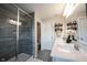 Modern bathroom with a glass-enclosed shower, double vanity, and stylish decor at 8194 Bostic Ct, Fishers, IN 46038