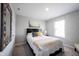 Well-lit bedroom with soft decor and a black headboard at 8194 Bostic Ct, Fishers, IN 46038